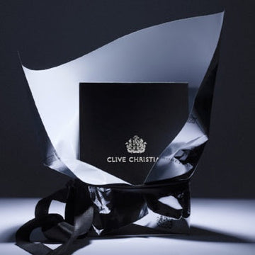 Clive Christian original collection X feminine scent perfume box wrapped in black and silver gift bag