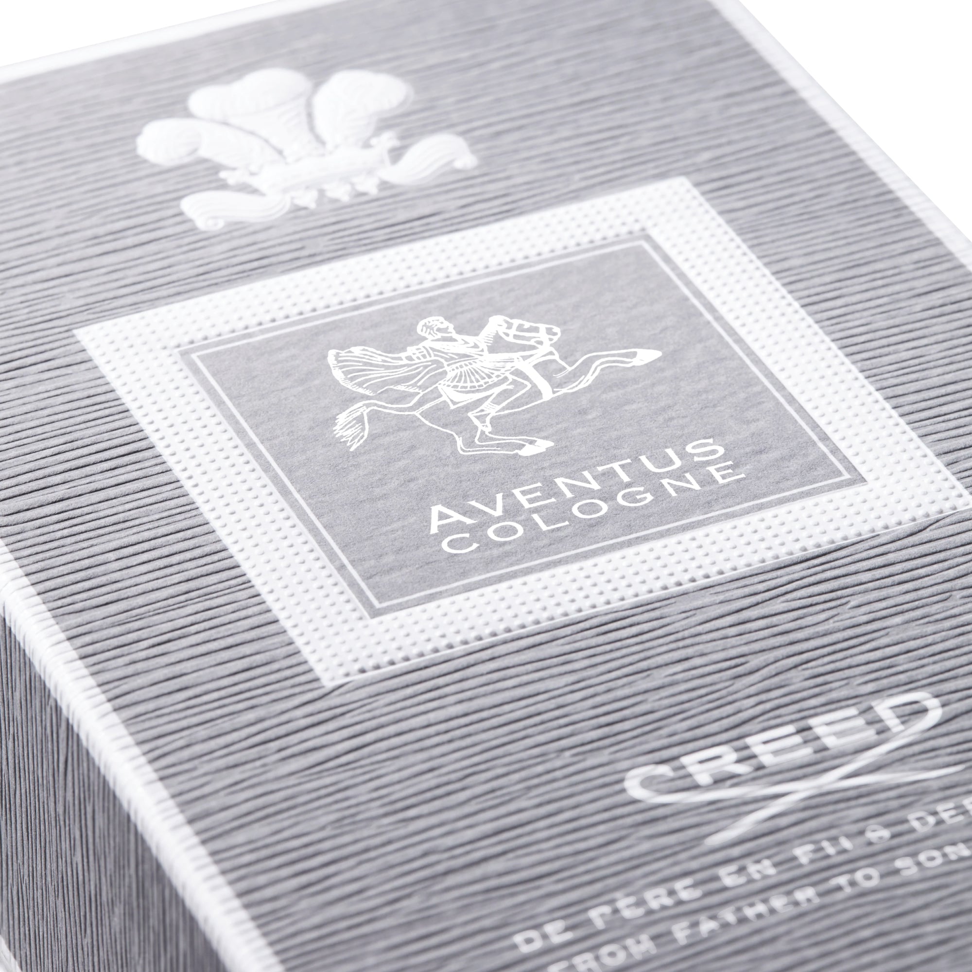 Close-up of Creed Aventus Cologne 100ml box with embossed logo and textured packaging design