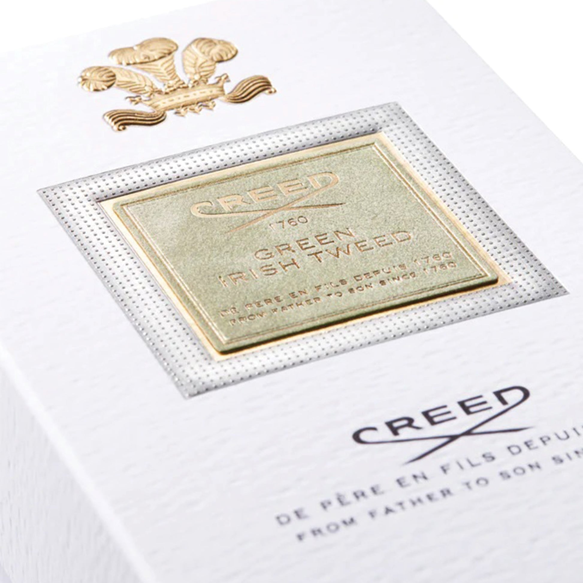 Close-up of Creed Green Irish Tweed 100ml perfume box with gold embossed label and logo