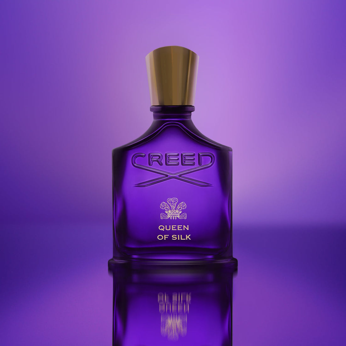 Creed Queen of Silk perfume 75ml in a purple glass bottle with gold cap on purple background