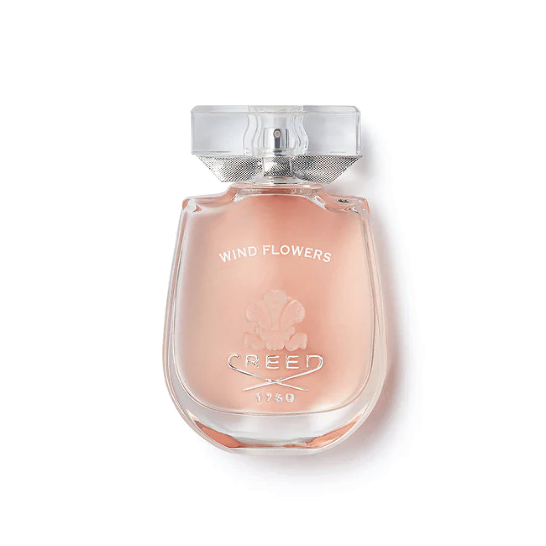 Clear glass bottle of Creed Wind Flowers perfume 75ml with light pink fragrance inside