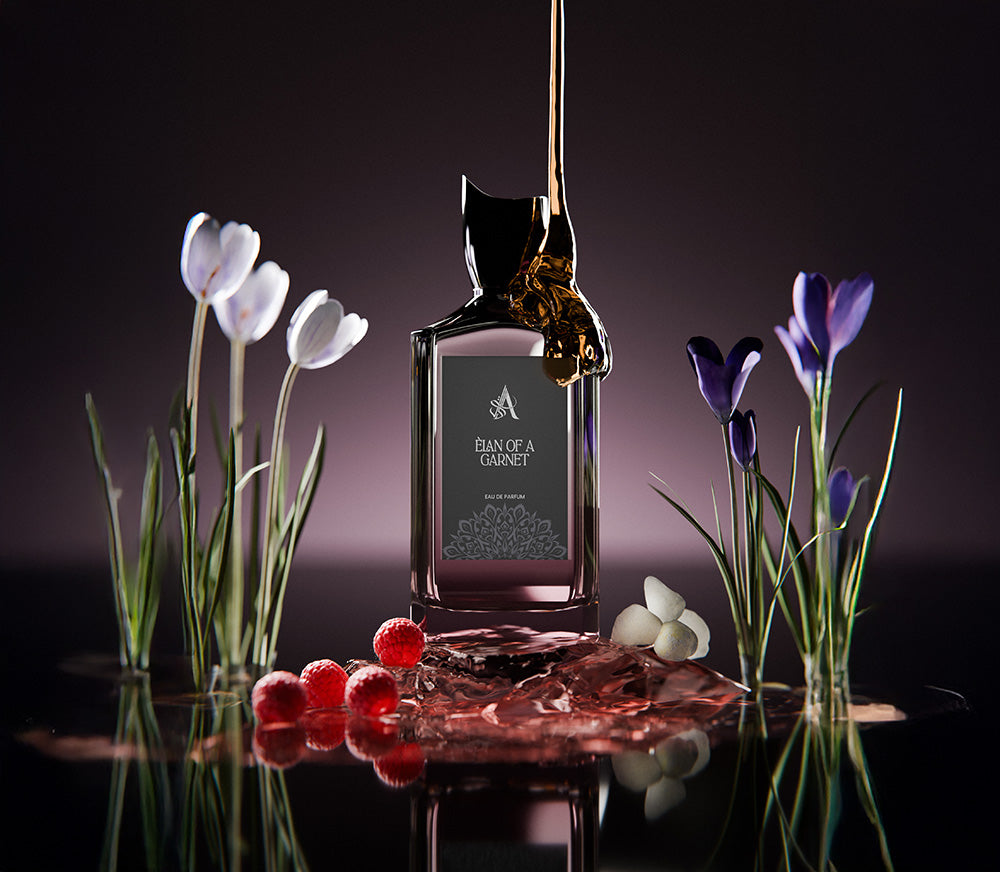 Artal Perfumes Elan of a Garnet perfume bottle with floral and berry accents on reflective surface