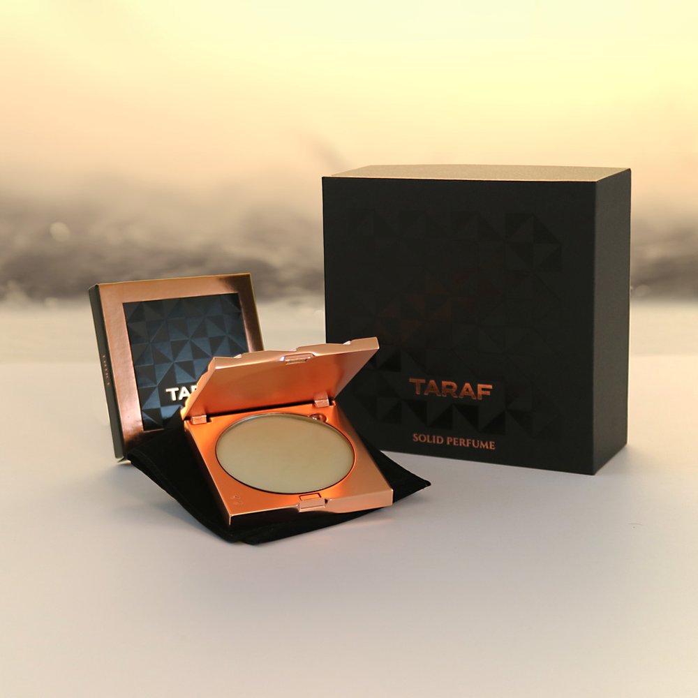 TARAF ENTICE SOLID PERFUME in elegant rose gold compact with black packaging box