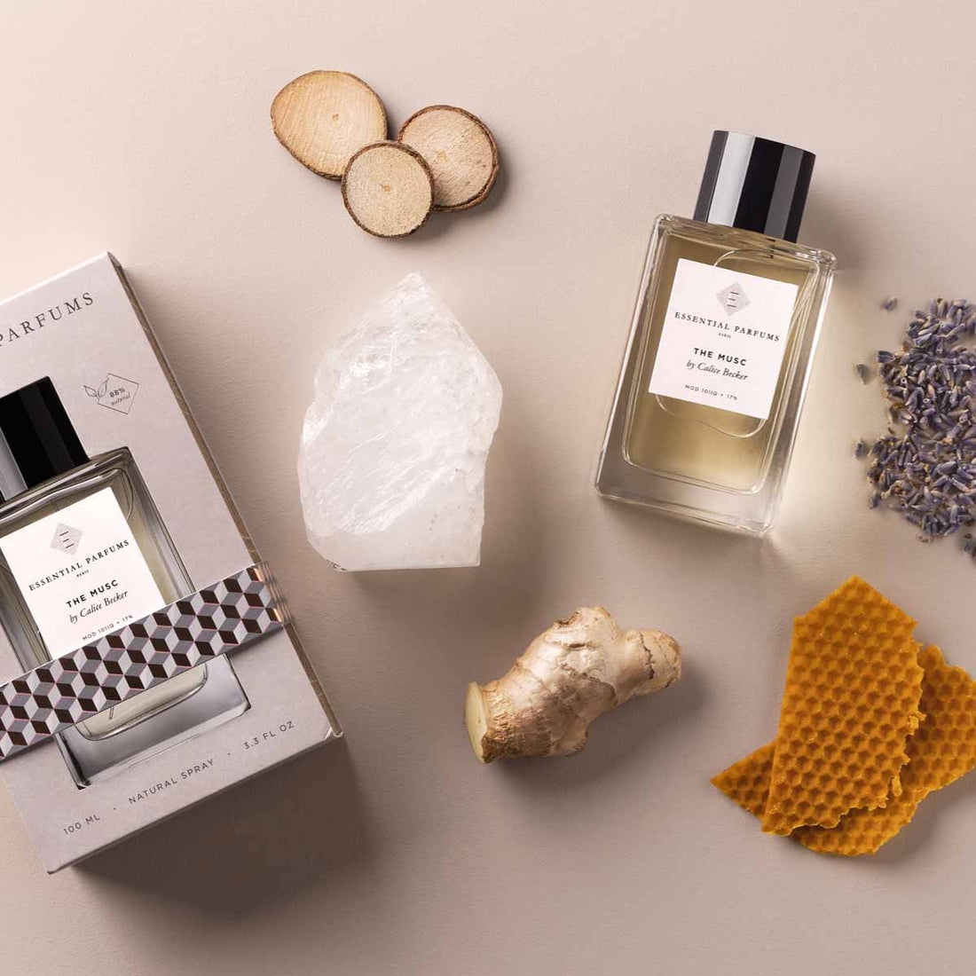 Essential Parfums The Musc 100ml perfume bottle with packaging surrounded by natural ingredients and honeycomb