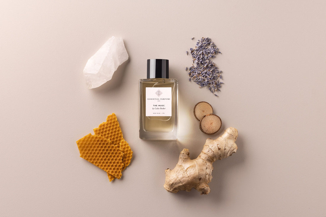 Essential Parfums The Musc 100ml perfume bottle with packaging surrounded by natural ingredients and honeycomb
