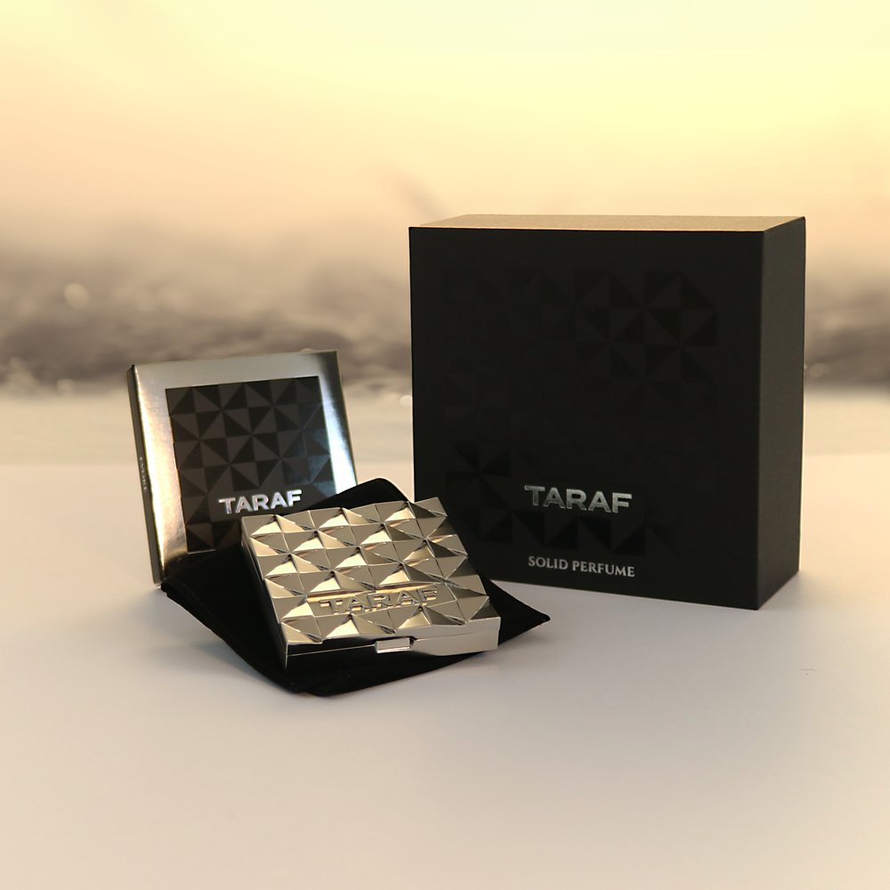 TARAF EVOKE solid perfume Dubai in a stylish silver compact with black branded packaging