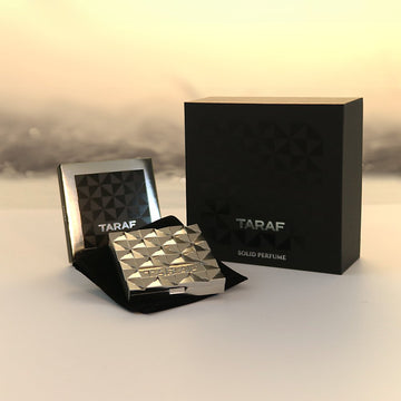 TARAF EVOKE solid perfume Dubai in a stylish silver compact with black branded packaging