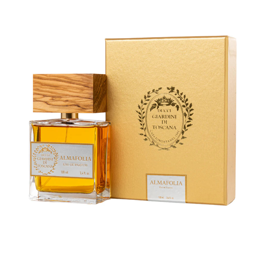 Giardini Di Toscana Almafolia perfume bottle with wooden cap and golden yellow fragrance inside