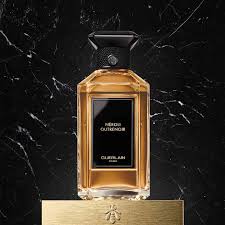 Guerlain Neroli Outrenoir 100ml perfume bottle with elegant design and golden liquid on marble background