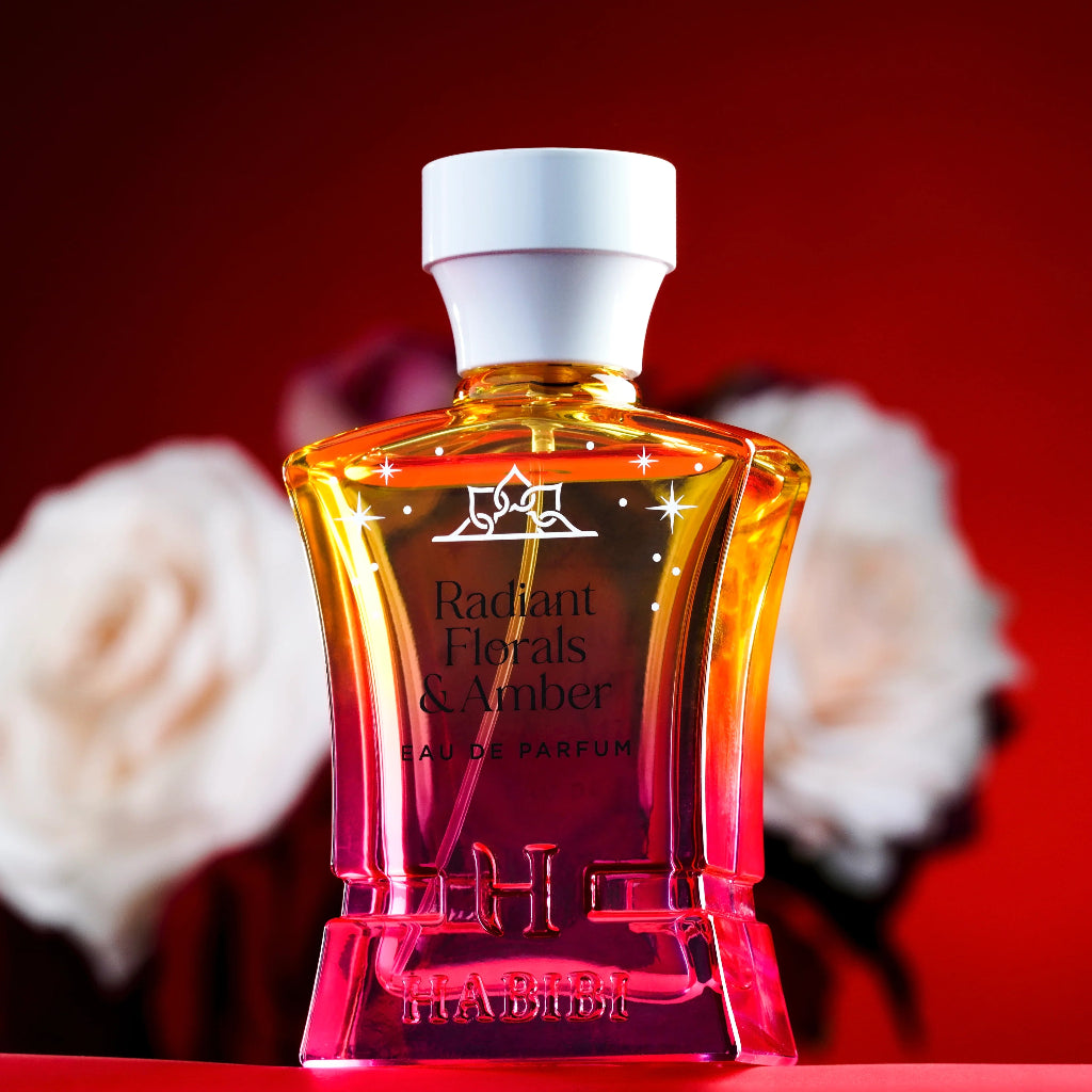 HABIBI NEW YORK Radiant Florals & Amber perfume in a pink and yellow gradient glass bottle with white cap