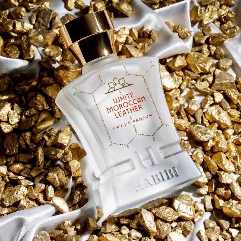 White Moroccan Leather perfume by HABIBI NEW YORK in frosted glass bottle with gold cap on gold stones