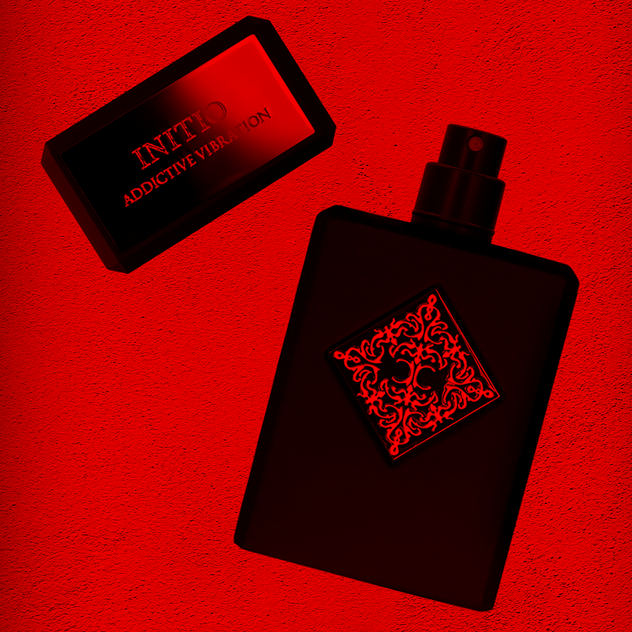 Initioparfums Addictive Vibration fragrance black spray bottle with decorative red label and matching cap on red background