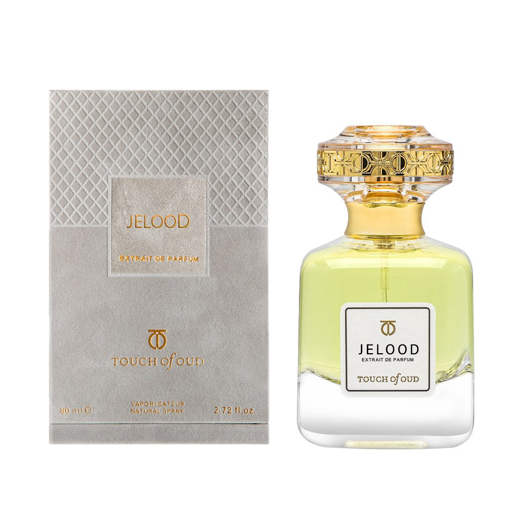 Touch Of Oud Jelood perfume in a clear bottle with gold decorative cap and light yellow fragrance