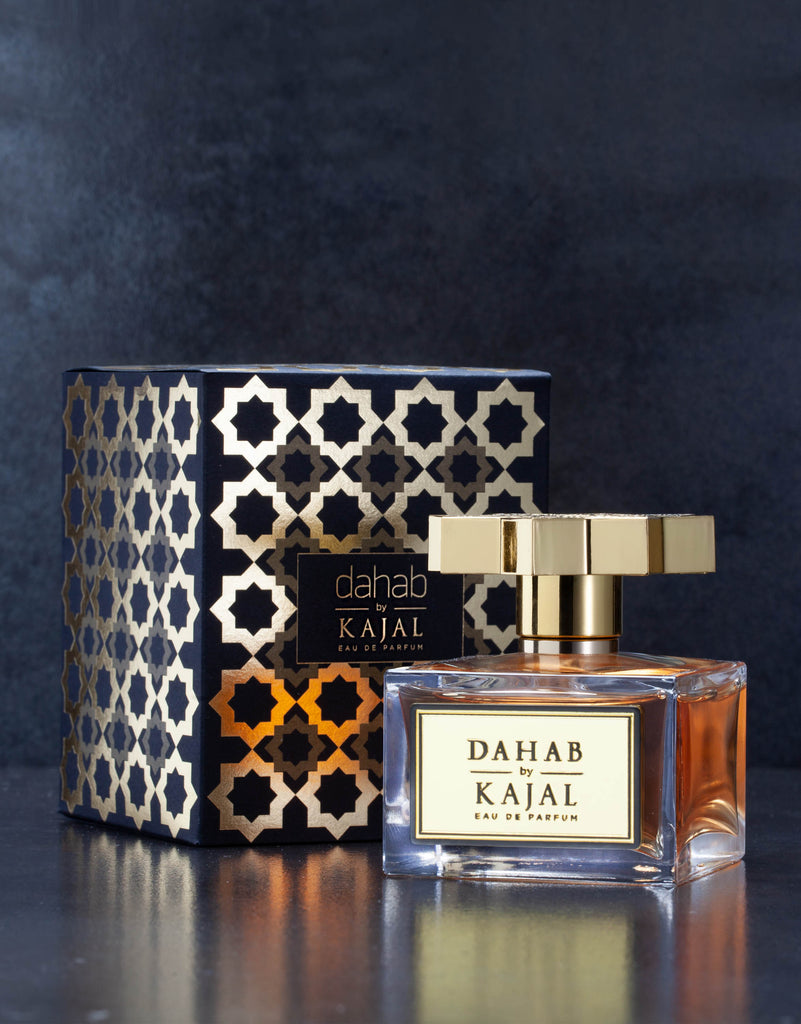 Dahab by Kajal perfume bottle with gold cap and decorative black and gold patterned box