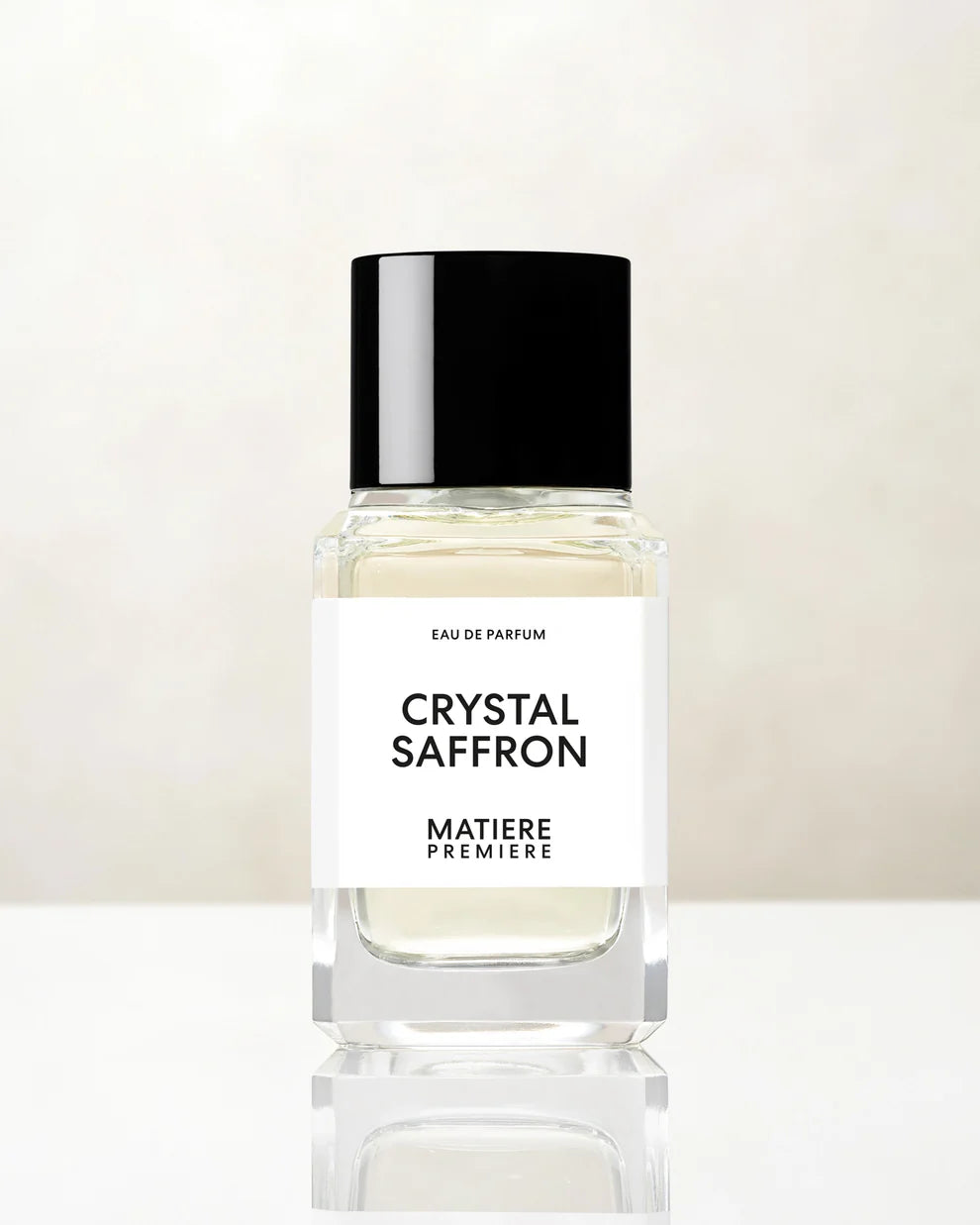 Matiere Premiere Crystal Saffron perfume bottle with clear glass and black cap on white surface
