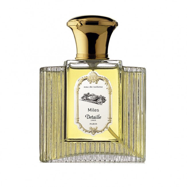 Detaille Miles perfume Dubai in a clear glass bottle with gold cap and vintage label