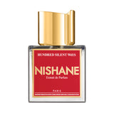 Nishane Hundred Silent Ways perfume bottle with red label and gold cap in clear glass container