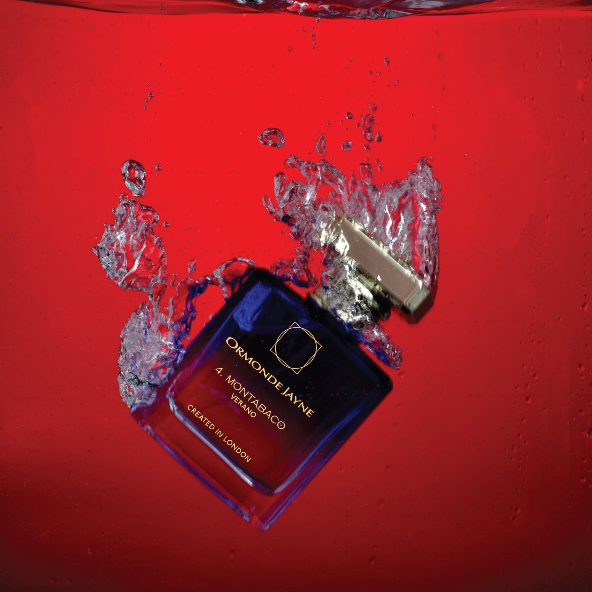 Ormonde Jayne Montabaco Verano 50ml perfume bottle submerged in water with red background