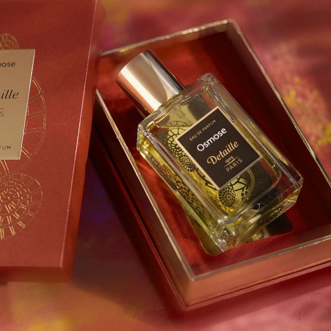Detaille Osmose perfume 50ml bottle with gold cap and black label in clear glass container