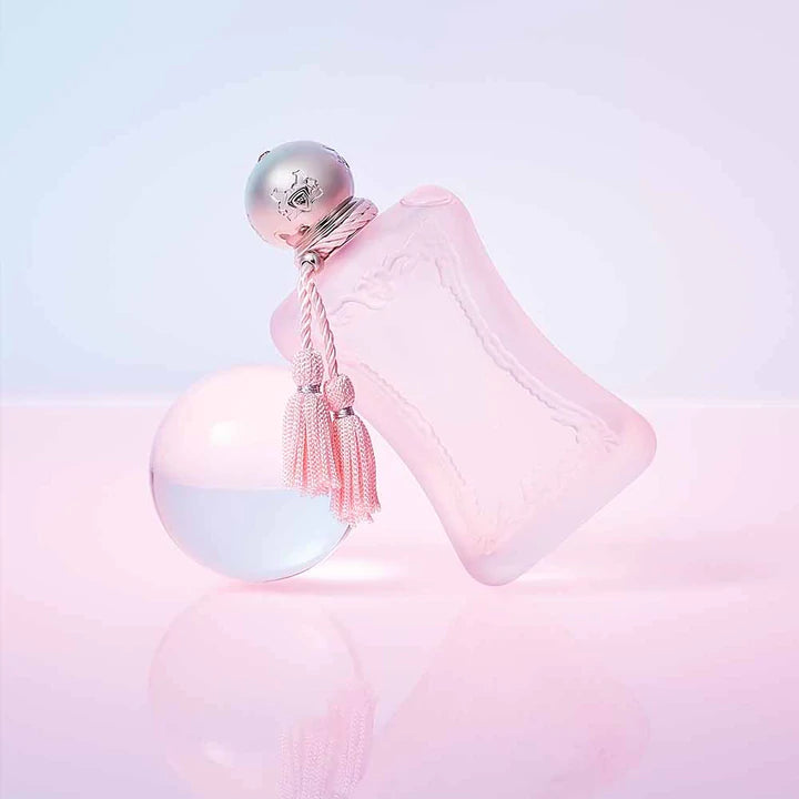 Parfums De Marly Delina La Rosee perfume bottle in frosted pink with silver cap and tassel detail