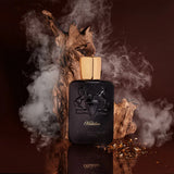 Parfums De Marly Habdan perfume bottle with black matte finish and gold cap against smoky wood background