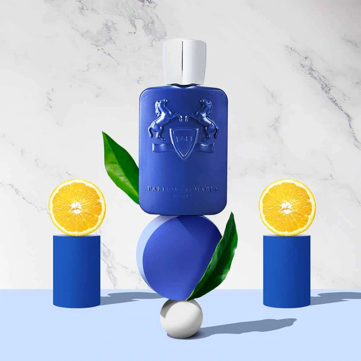Parfums de Marly Percival 125ml blue perfume bottle with citrus and green leaves on geometric shapes