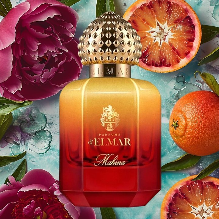 Mahina by Parfums d'Elmar perfume bottle with gradient red and orange design surrounded by flowers and citrus fruits