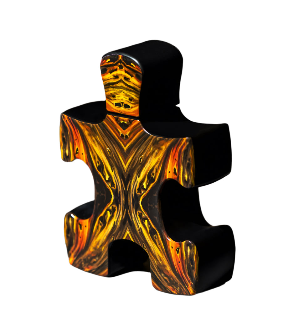 Puzzle Lal fragrance by Puzzle Perfume in a uniquely designed black and orange puzzle piece bottle