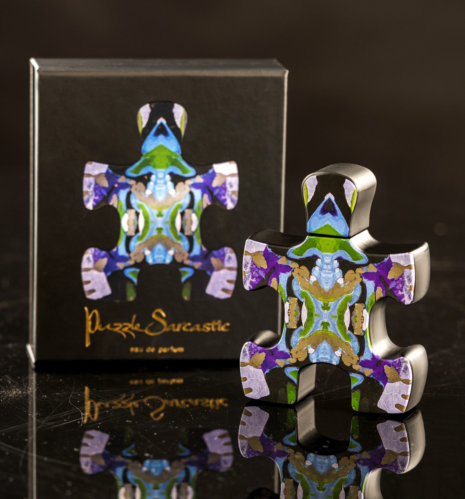 Puzzle Sarcastic perfume bottle and box featuring colorful abstract puzzle piece design