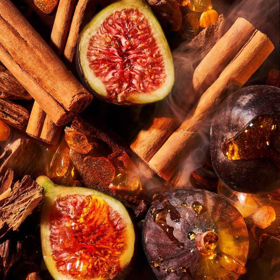 Close-up of aromatic ingredients with figs and cinnamon sticks for amber oud parfum for sale by Roja Parfums