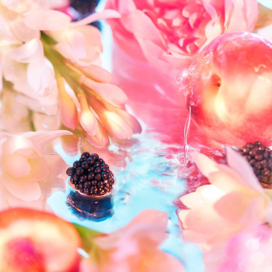 Roja Parfums Elysium Pour Femme perfume inspired by fresh florals and juicy blackberries on reflective surface