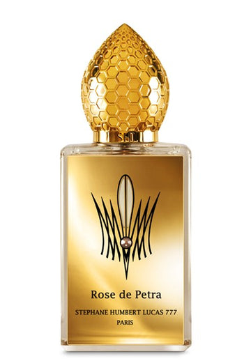 Stephane Humbert Lucas Rose de Petra perfume bottle with gold honeycomb cap and elegant gold label