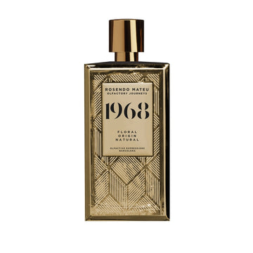 Rosendo Mateu 1968 perfume in a gold geometric patterned bottle with a shiny gold cap