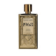 Rosendo Mateu 1968 perfume in a gold geometric patterned bottle with a shiny gold cap