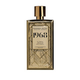 Rosendo Mateu 1968 perfume in a gold geometric patterned bottle with a shiny gold cap