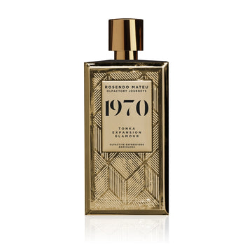 Rosendo Mateu 1970 perfume in a gold geometric patterned bottle with a shiny gold cap