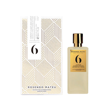 Rosendo Mateu No6 hair perfume bottle and white geometric patterned box with gold accents