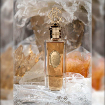 ROYAL GLORY Amber Dynasty perfume 100ml bottle with intricate gold cap and amber liquid inside