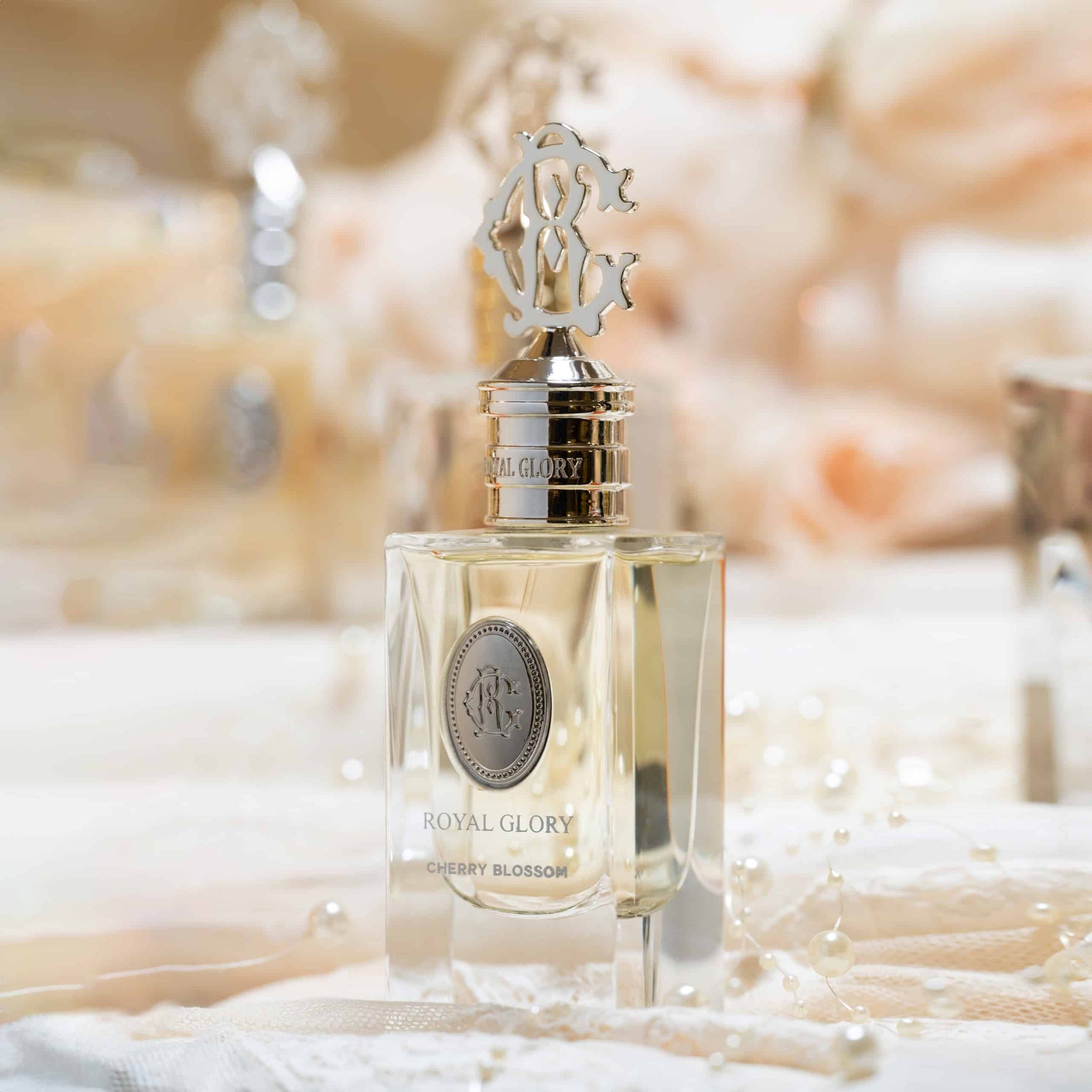 Royal Glory cherry blossom perfume 60ml bottle with elegant gold cap and clear glass design