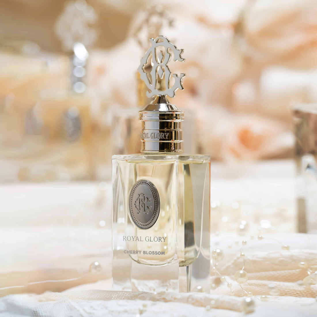 Royal Glory cherry blossom perfume 60ml bottle with elegant gold cap and clear glass design
