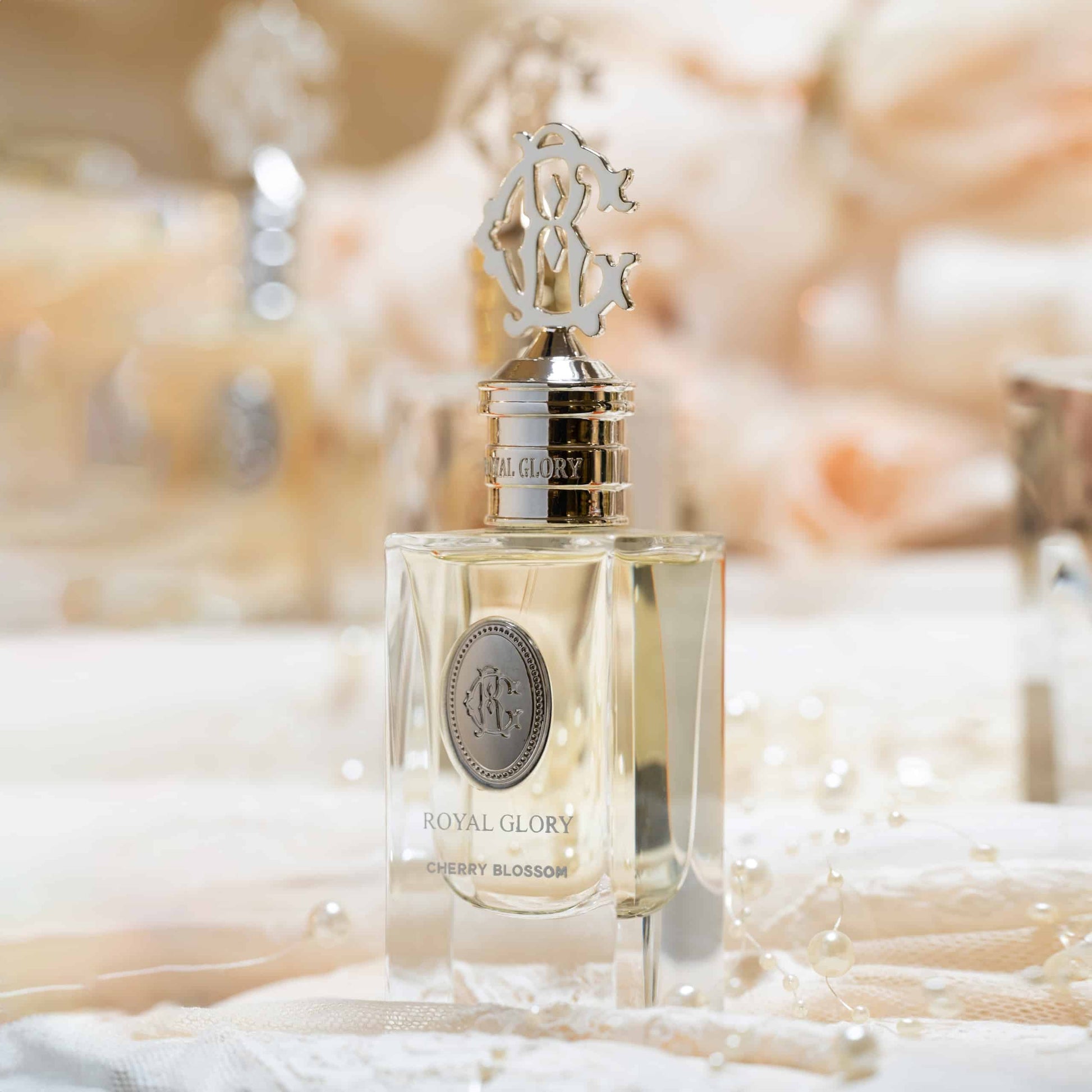 Royal Glory cherry blossom perfume 60ml bottle with elegant gold cap and clear glass design