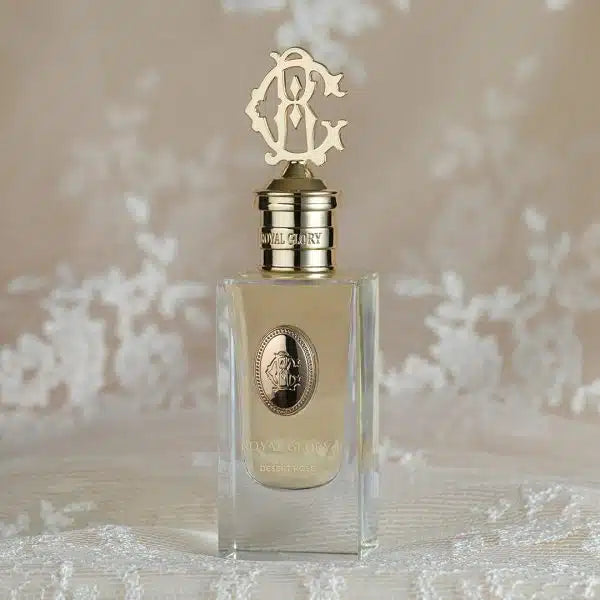 Royal Glory Desert Rose perfume 60ml bottles with elegant gold and silver caps displayed on lace fabric