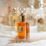 ROYAL GLORY Lady In Red perfume 60ml with golden cap and amber liquid in clear glass bottle