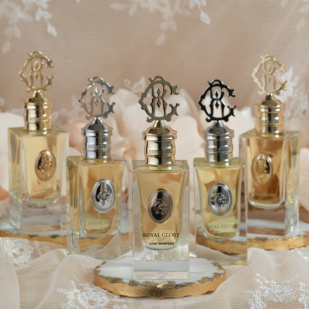 ROYAL GLORY LOVE WHISPERS perfume Dubai displayed in elegant glass bottles with ornate gold and silver caps