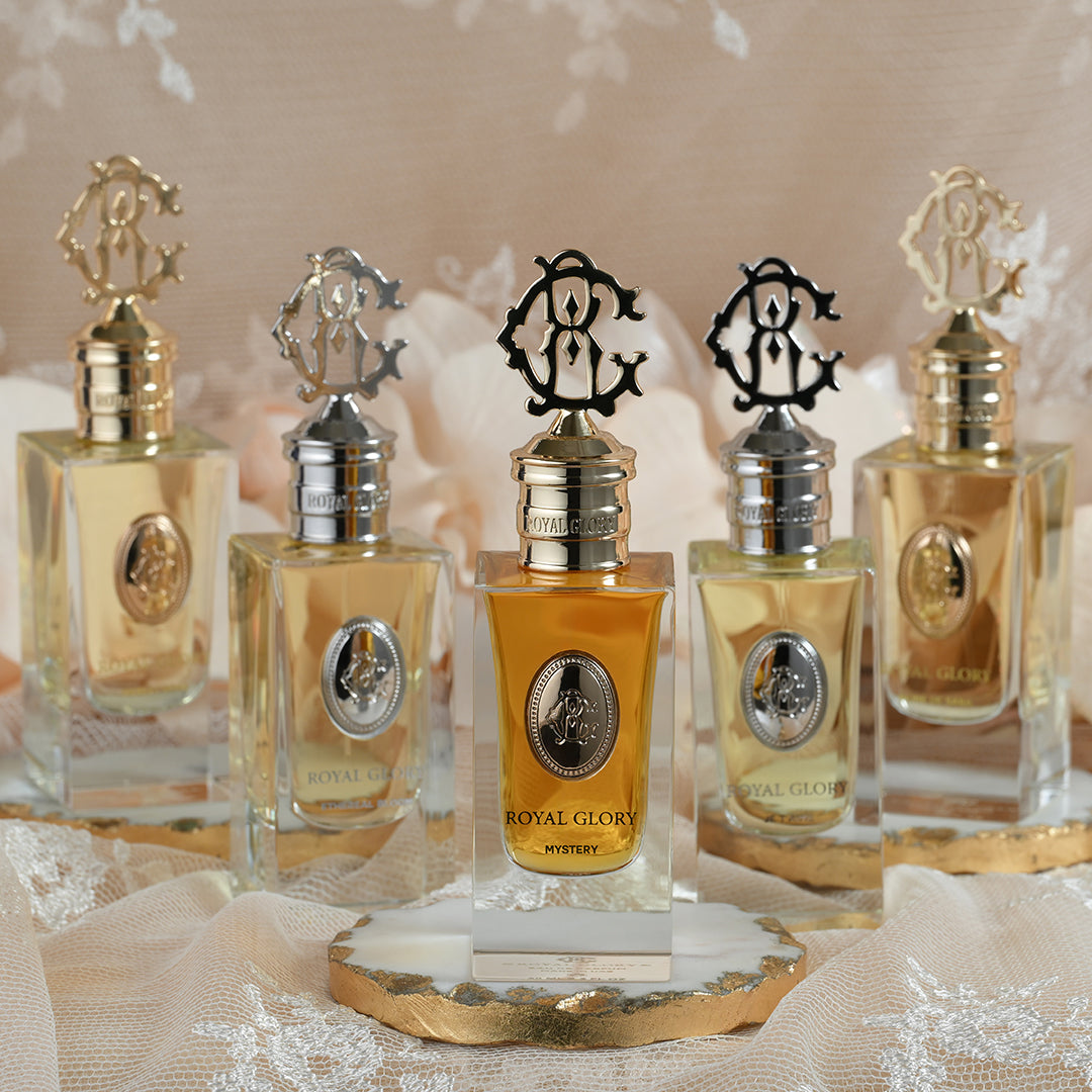 ROYAL GLORY MYSTERY 60ml exclusive scent perfume bottle with gold and silver caps displayed on lace fabric