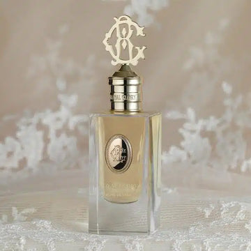 Royal Glory Reine de Saba Eau de Parfum in a luxury clear glass bottle with gold decorative cap