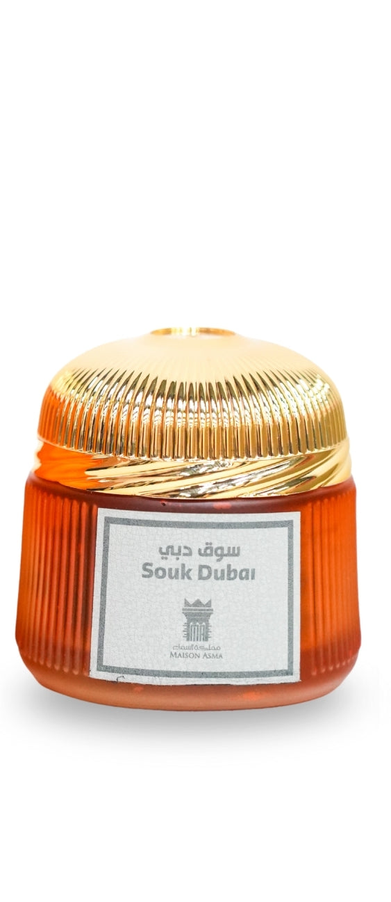 Maison Asma Souk Dubai Dhakoun perfume bottle with ribbed amber glass and gold cap