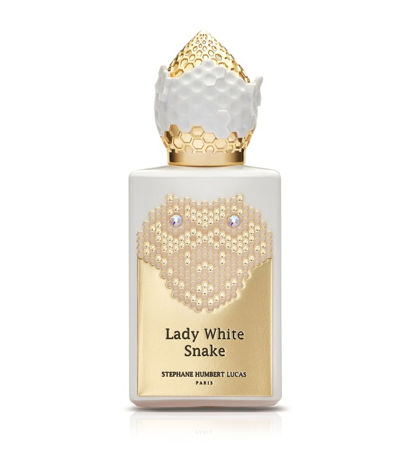 Elegant Lady White Snake perfume bottle featuring a unique honeycomb design and gold accents