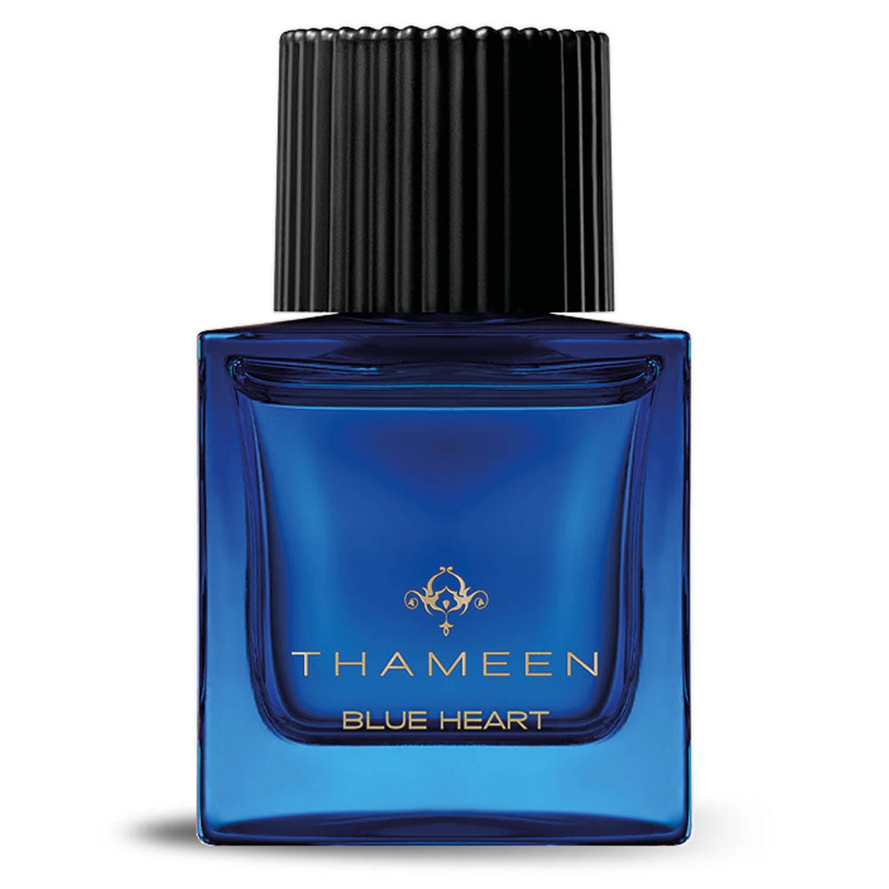 Thameen Blue Heart perfume in a blue glass bottle with black ribbed cap from Thameen London fragrance