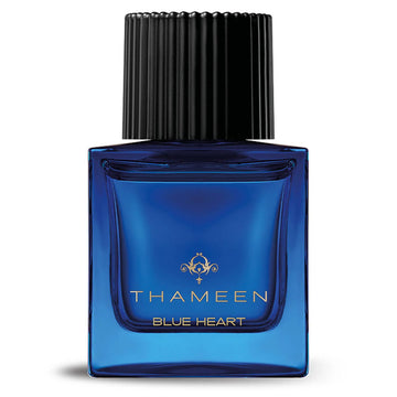 Thameen Blue Heart perfume in a blue glass bottle with black ribbed cap from Thameen London fragrance
